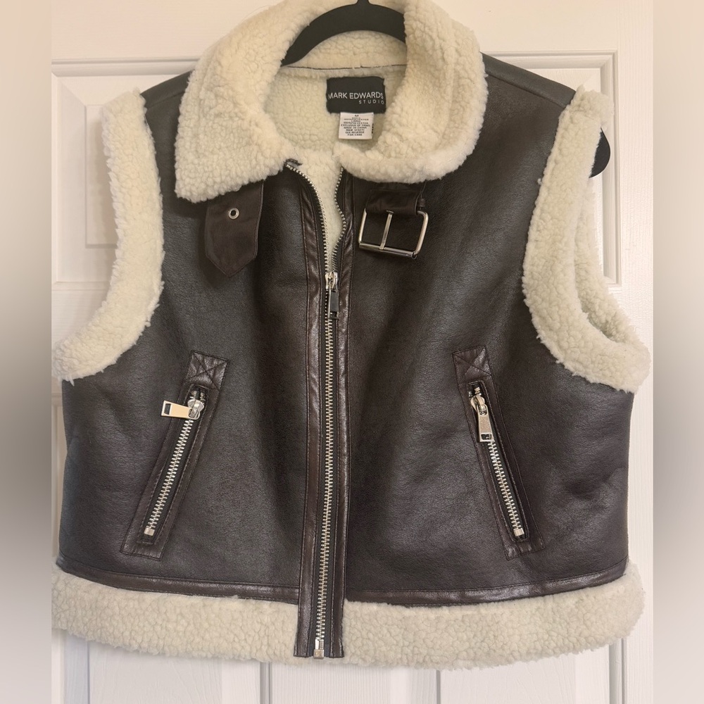 Sherpa lined faux leathered vest